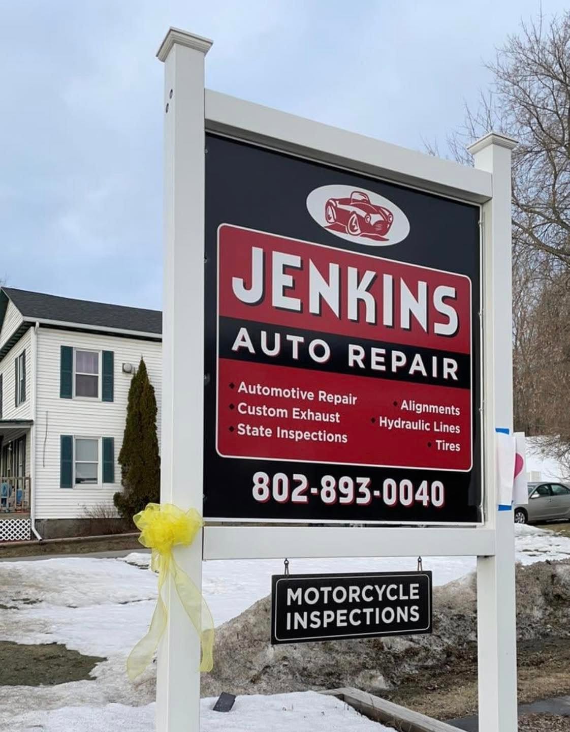 Roadside sign for the shop at 26 River Street in Milton, Vermont
